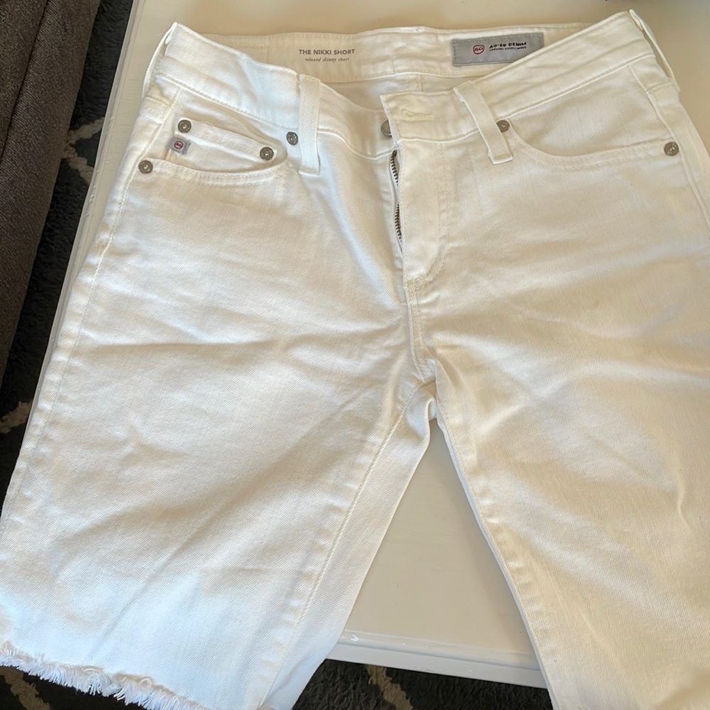 White ag-ed denim shorts
